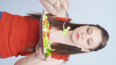 Vertical-video-of-Dieter-eats-salad.-Healthy-eating.